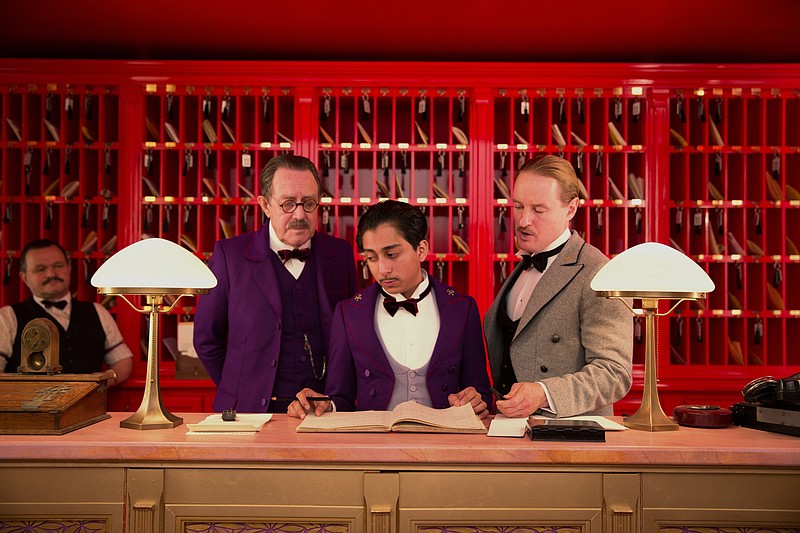 This image released by Fox Searchlight shows Tom Wilkinson, Tony Revolori, center, and Owen Wilson, right, in "The Grand Budapest Hotel ."