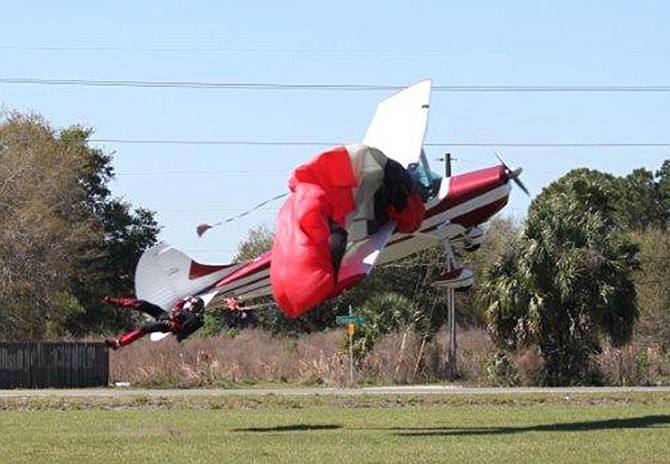 Cessna pilot Shannon Trembely struggles with the controls after snagging John Frost's parachute. Moments later, the Cessna nosedives into the ground and Frost falls with his parachute dangling uselessly.
