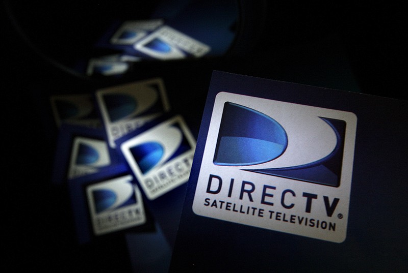 In this Thursday, Aug. 6, 2009, file photo, DirecTV logos are seen on flyers in North Andover, Mass. From 2008 to 2013, earnings per share of DirecTV nearly quadrupled, due mostly to the company cutting the number of its shares in circulation by purchasing them from investors.