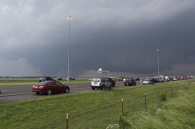 A tornado moves through Moore, Okla., as northbound traffic on Interstate 35 stops at Indian Hills Road. The National Weather Service in Norman has used Twitter and Facebook for years to disseminate weather warnings. But they tried a new approach recently, holding an online tornado drill. 