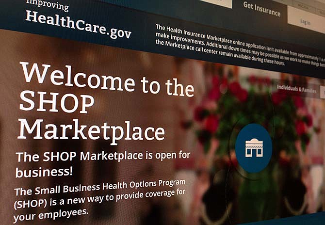 This Nov. 27, 2013, file photo shows part of the HealthCare.gov website page featuring information about the SHOP Marketplace. 