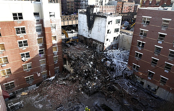 Rubble is seen Friday, two days after a natural gas explosion leveled two apartment buildings in New York. Using sound devices to probe for voices and telescopic cameras to peer into small spaces, workers searching a pile of rubble from a gas explosion in the East Harlem section of Manhattan, continued to treat it as a rescue operation.