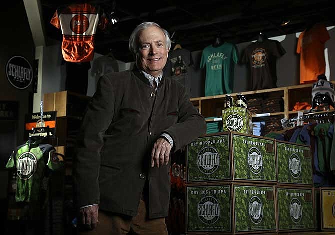 Tom Schlafly, co-founder of the brewery which produces the Schlafly brand of beers, poses for a photo inside the gift shop at Schlafly Bottleworks on Wednesday, March 12, 2014, in Maplewood, Mo. Schlafly has been in a trademark dispute with his aunt, conservative activist Phyllis Schlafly, over whether Schlafly is primarily a last name or a commercial brand that deserves legal protection.