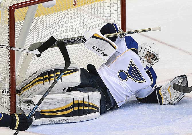 St. Louis Blues goalie Ryan Miller (39) fails to stop a goal by Nashville Predators forward Eric Nystrom in the second period of an NHL hockey game on Saturday, March 15, 2014, in Nashville, Tenn.