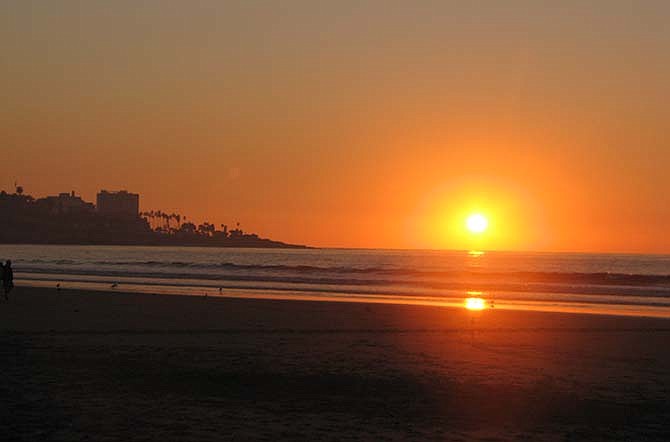From La Jolla Shores, visitors can watch the sun set over La Jolla, Calif. Travel agent Lindy Capps says San Diego is a great destination for families, because there's a variety of activities