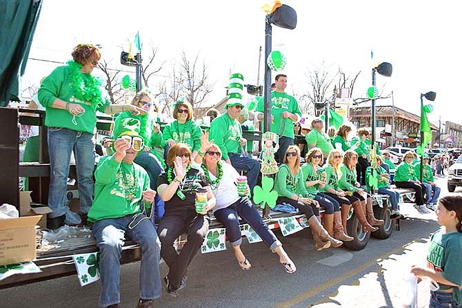 Members of the "O'Herb's Krewe" float - complete with "St. Patrick" aboard - enjoyed tossing beads and candy out to Lake of the Ozarks St. Patrick's Day Parade goers Saturday.