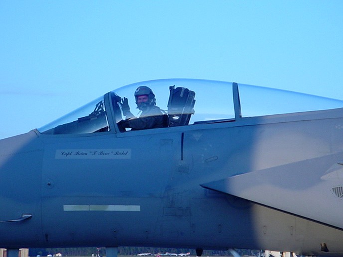 Terry Walker is pictured above in the cockpit of an F-15 Eagle while serving as an instructor at Tyndall AFB in 2005. Today, Walker is a Jefferson City teacher and football coach.