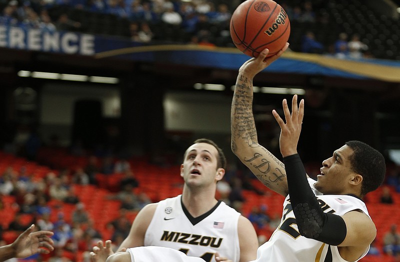 Jabari Brown (front), Ryan Rosburg and the Missouri Tigers will face the Davidson Wildcats in the opening round of the NIT tonight at Mizzou Arena.