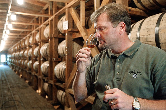 Jeff Arnett, the master distiller at the Jack Daniel Distillery in Lynchburg, Tenn., tests the aroma of whiskey at the distillery.