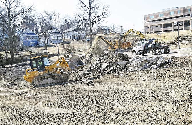 A project to expand Capital Region Medical Center has begun on property north of the current facility in Jefferson City. At least one more of the houses on Monroe Street in the background will be torn down for the project. 