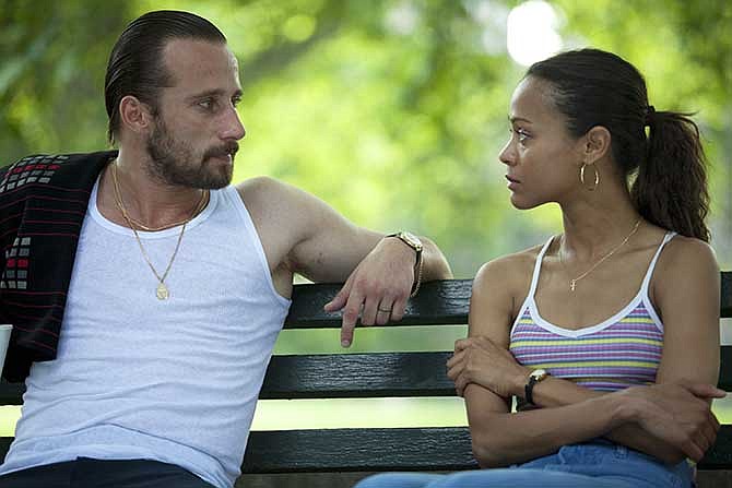 This image released by Roadside Attractions shows Matthias Schoenaerts, left, and Zoe Saldana in a scene from "Blood Ties."