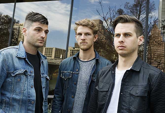 Foster The People's Cubbie Fink, left, Mark Pontius, center, and Mark Foster, pose for a photograph during the SXSW Music Festival on Thursday, March 13, 2014, in Austin, Texas. 