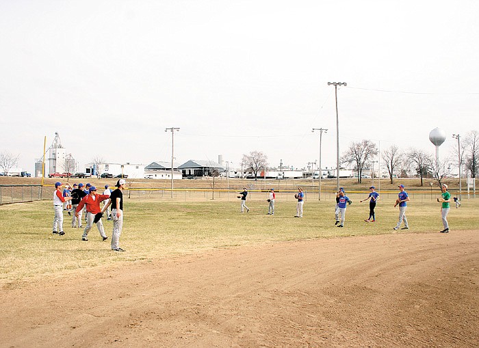 Democrat photo / April Arnett
Members of the California High School varsity and JV baseball teams loosen at the start of practice Friday afternoon at the California Sports Complex. The Pintos started off the 2014 season by hosting Eugene Monday.