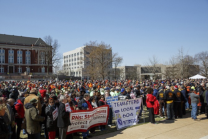 A crowd of Missouri union workers cheers during Gov. Jay Nixon's speech Wednesday morning on the Capitol lawn. 