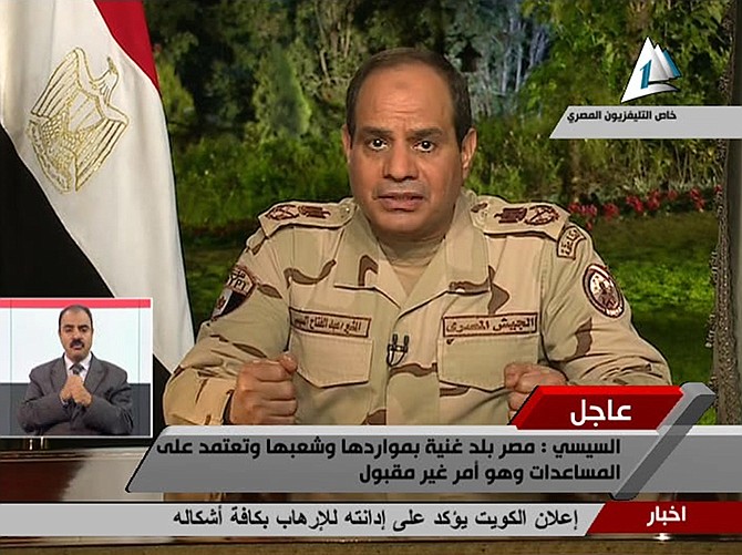 In this image made from video broadcast on Egypt's State Television, Egypt's military chief Abdel-Fattah el-Sissi speaks in a nationally televised speech, announcing that he will run for president, in Cairo, Egypt.