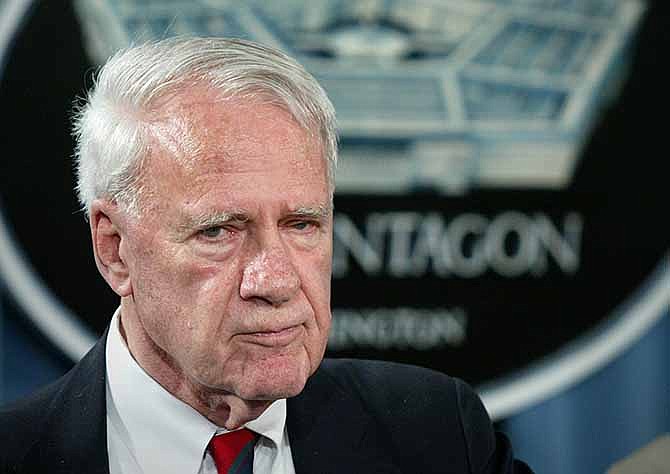 This Aug. 24, 2004 file photo shows former Defense Secretary James Schlesinger, chairman of the Detention Operations Review Panel speaking at the Pentagon. A Washington think tank confirms Schlesinger died Thursday at age 85. 