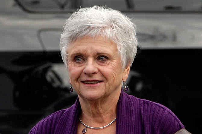 In this Oct. 9, 2012 file photo, Dottie Sandusky, the wife of former Penn State University assistant football coach Jerry Sandusky arrives for the sentencing of her husband at the Centre County Courthouse in Bellefonte, Pa. Dottie Sandusky says it was long after he'd been arrested, tried and convicted before she realized just how much trouble the former Penn State assistant football coach had gotten himself into.