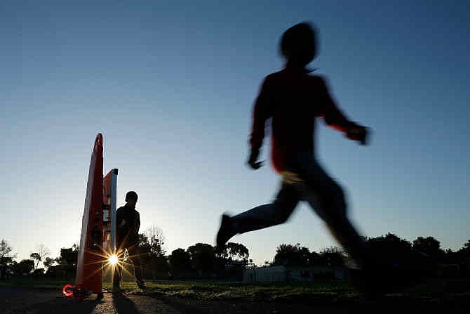 In this March 14, 2014 picture, students take part in an early morning running program at an elementary school in Chula Vista, Calif. Amid alarming national statistics showing an epidemic in childhood obesity, hundreds of thousands of students across the country are being weighed and measured. The Chula Vista Elementary School District is being touted as a model for its methods that have resulted in motivating the community to take action. 