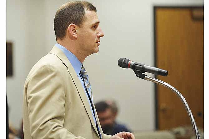 Jefferson City's interim finance director, Bill Betts, addresses the mayor and city council members regarding questions about the proposed conference centers at a public hearing on the proposals last week.