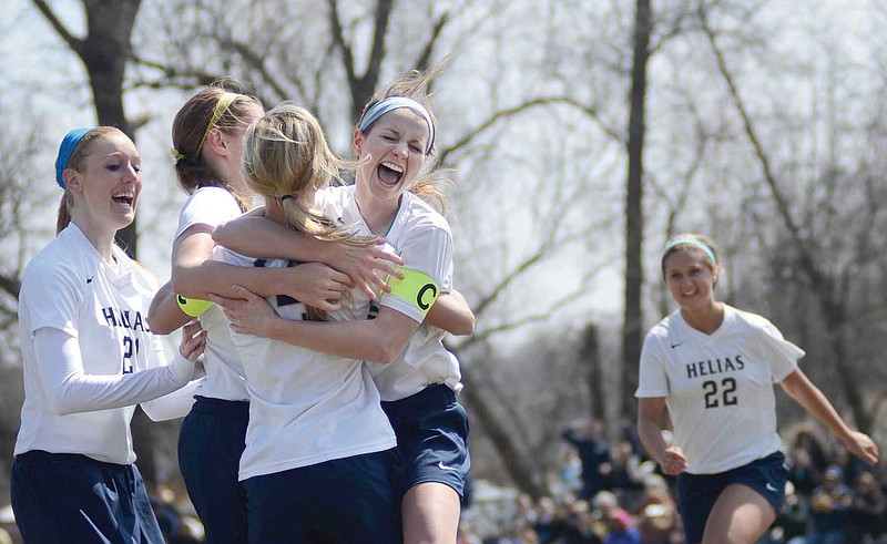 Becky Roberts celebrates with her Helias teammates after scoring a tying goal in Saturday's game against Quincy Notre Dame at the 179 Soccer Park in Jefferson City.