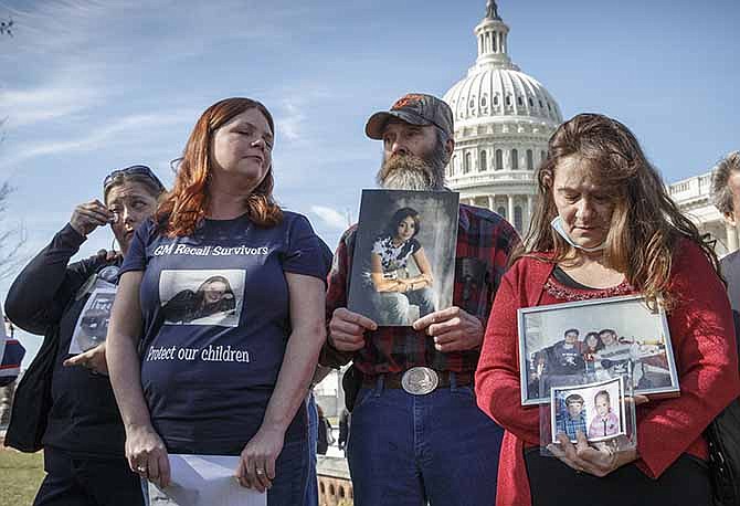 Kim Langley, far left, mother of Richard Scott Bailey, a U.S. Marine who died driving a 2007 Chevy Cobalt, Laura Christian, center left, of Harwood, Md., birth mother of Amber Marie Rose, the first reported victim of the GM safety defect, Randal Rademaker, center, father of Amy Rademaker of St. Croix County, Wis., who died when her Chevy Cobalt crashed and her air bags did not deploy, and Shannon Wooten of Adams, Tenn., whose son son Joshua died a 2009 crash driving their 2006 Chevy Cobalt, gather at the Capitol for a news conference in Washington, Tuesday, April 1, 2014. 