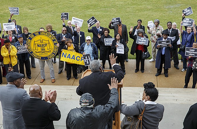 A group of black clergy and other faith leaders stood on the steps of the Capitol on Thursday and continued to press the Legislature to expand Medicaid.