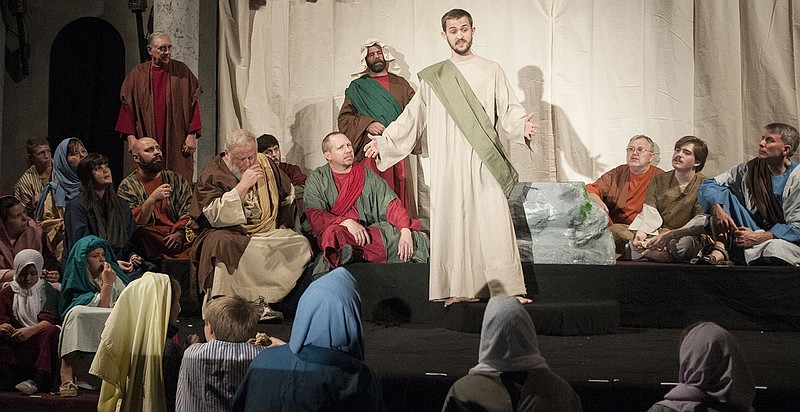 Jesus Christ, played by First Baptist Church member Shawn Campbell, talks to the people of Jeruselum during the church's rehearsal of its Easter Pageant.