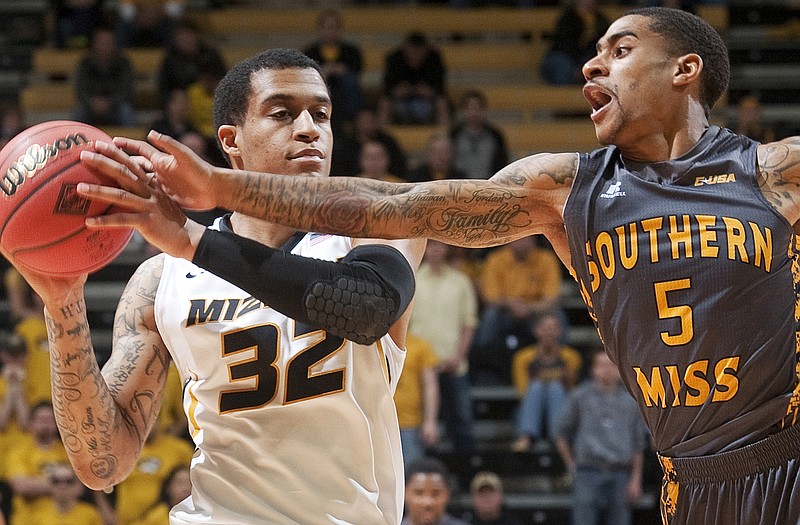 Missouri guard Jabari Brown tries to keep the ball away from Southern Mississippi's Neil Watson during an NIT game last month at Mizzou Arena. Brown announced his intentions to leave the Tigers and enter his name for the NBA Draft on Wednesday.