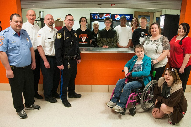 New Bloomfield firefighters, police chief Chris Hammann, high school students and educators, including Assistant Principal Susan Dudley and Special Services Director Sarah Wisdom gathered around the high school's concession stand for a photo to celebrate the installation of a cappuccino machine. With the machine and coffee makers, the students will open Wildcat Brew and serve hot chocolate, coffee and, of course, cappuccinos. Wisdom said students will develop their own business plans and learn job skills while working as baristas.