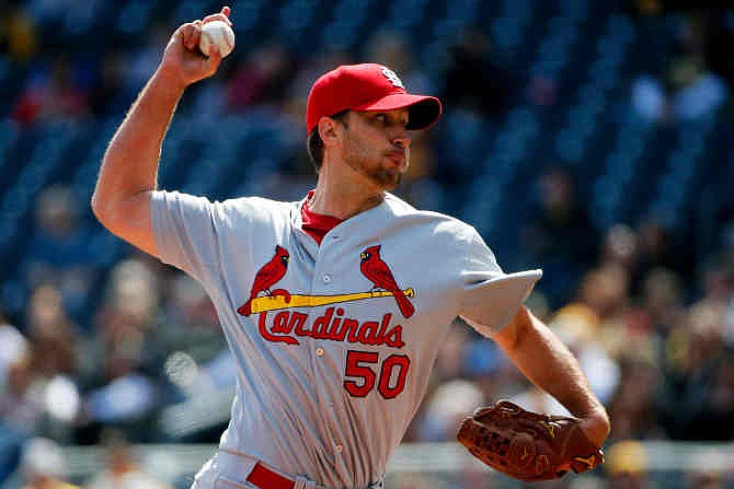 St. Louis Cardinals starting pitcher Adam Wainwright (50) delivers during the third inning of a baseball game against the Pittsburgh Pirates in Pittsburgh, Sunday, April 6, 2014. 