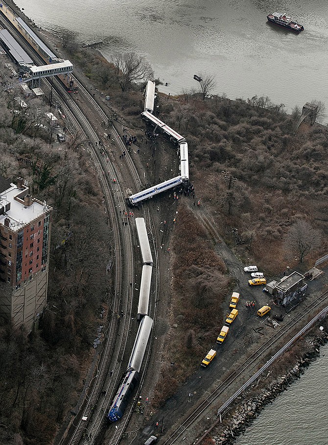 A Metro-North passenger train lays on it's side after derailing on a curved section of track  in the Bronx borough of New York. Federal investigators say William Rockefeller, who was engineer on a New York commuter train that derailed last year, killing four people, has a serious sleep disorder.