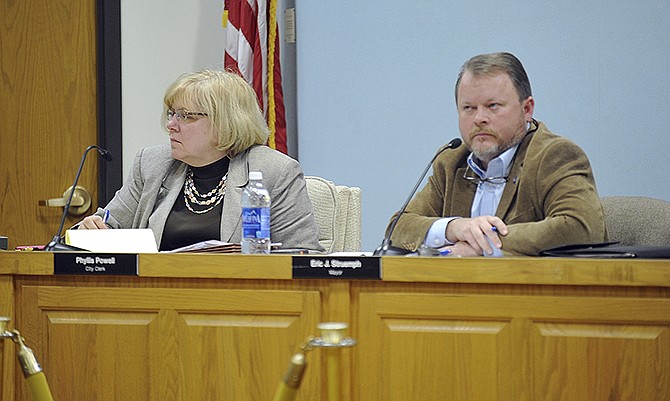 Mayor Eric Struemph listens to discussions during a public hearing on two conference center proposals. The City Council voted to reject both proposals during a Monday night meeting. 