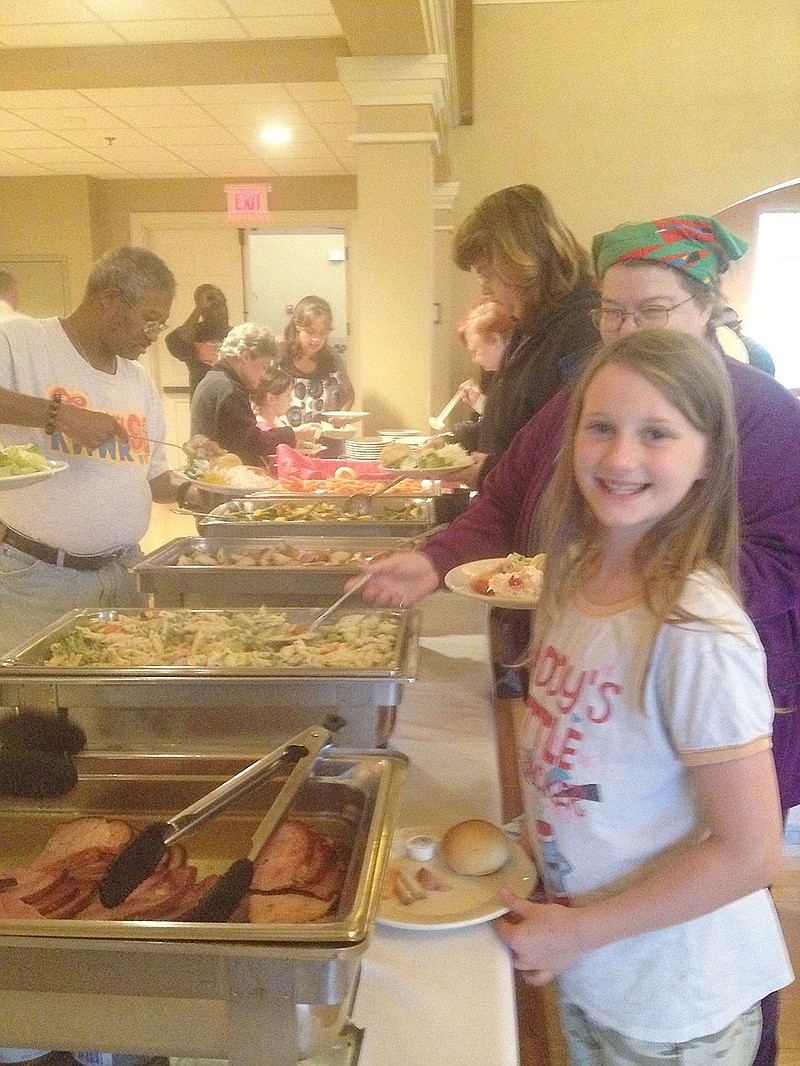 Attendees of the 2013 Fulton Soup Kitchen Easter Dinner make their way through the buffet line. The meal, prepared by the staff of Fresh Ideas dining services from Westminster College will take place April 16.