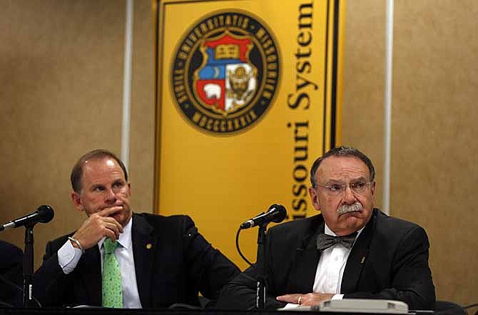 University of Missouri President Tim Wolfe, left, and University of Missouri Chancellor R. Bowen Loftin participate in a news conference Friday, April 11, 2014, in Rolla, Mo. The news conference was held to discuss an outside legal review of the university's response to a case involving school swimmer Sasha Menu Courey, who killed herself 16 months after an alleged off-campus rape by as many as three football players in February 2010. 