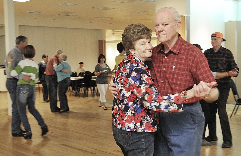 Stan and Teresa Neuner twirl around the dance floor Friday as volunteers were celebrated and shown appreciation during the Volunteer Celebration at the Capital Mall Community Room. In addition to volunteering at their church, St. Joseph Cathedral, they help out at the Amtrak station greeting riders. The Starlight Memories Band provided music for those who wanted to participate in the early afternoon celebration.