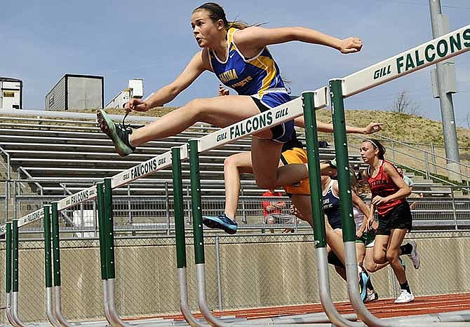 Fatima's Katie Eichholz starts to distance herself from the rest of the field as she wins her heat in the girls 100-
meter hurdles during Saturday's Blair Oaks Invitational at the Falcon Athletic Complex in Wardsville, Mo.