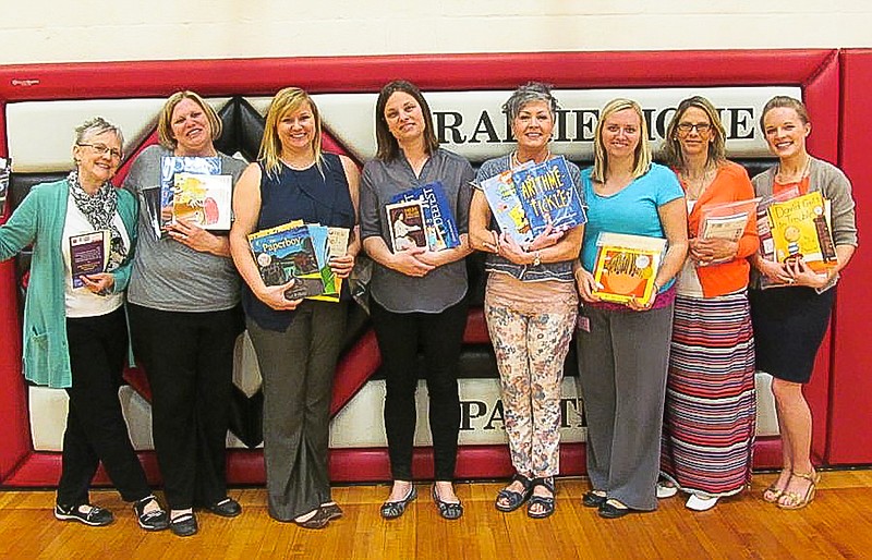 The United Methodist Women recently delivered the results of their book drive to Prairie Home School. Pictured (with some of the books) are Nancy Kixmiller, UMW president; Jessi Cater, second grade; Rachel Martin, kindergarten; Jennifer Lenger, fourth grade; Sarah Stidham, third grade; Randa Robb, first grade; Deanna Null, Reading; Elyse Burks, sixth grade.