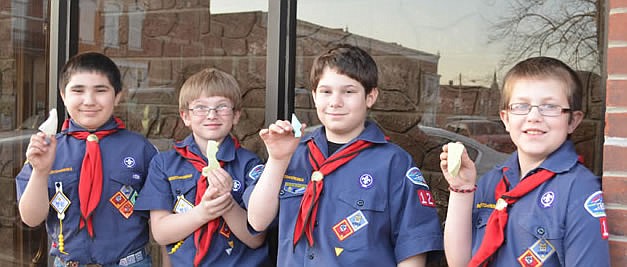 Webelos show their fine soap carvings, from left to right, are Diego Vasquez, Braydon Knipp, Peter Dampf and DJ Schneider.