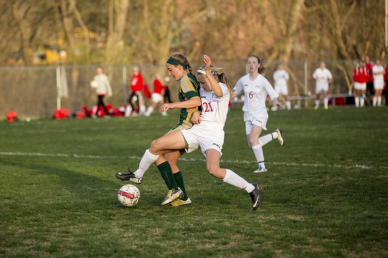 Jefferson City's Sarah Luebbert takes the ball away from Rock Bridge's Ronni Farid during Tuesday's game.