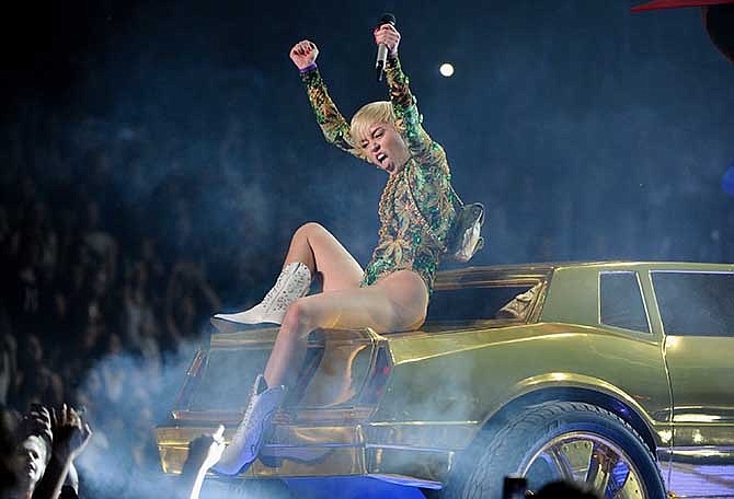 Singer Miley Cyrus performs at the Barclays Center on Saturday, April 5, 2014 in New York.