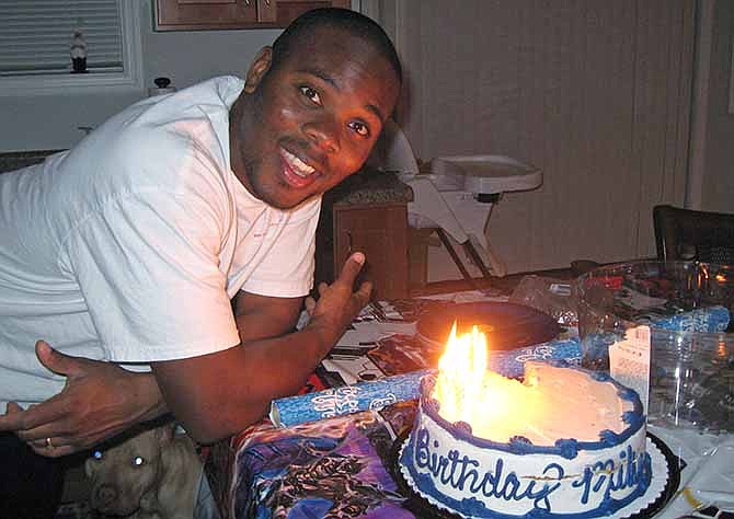 In this photo provided by attorney Patrick Megaro is his client, Cornealious "Mike" Anderson, with a birthday cake. Anderson, who avoided prison because of a clerical error and led a law-abiding life for 13 years, said he is overwhelmed by the support he's received since the story of his incarceration became public. Meanwhile, the Missouri attorney general signaled that he would look for a way to take Anderson's many years of clean living into account in attempting to resolve the "difficult situation." 