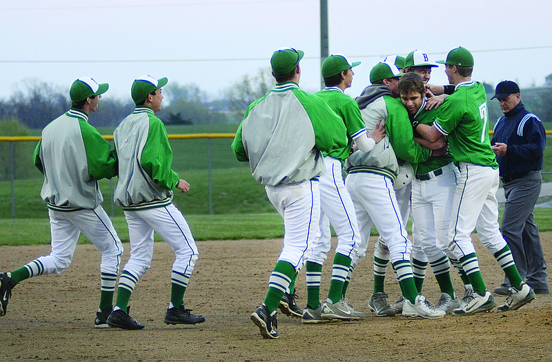 Blair Oaks celebrates after scoring a run in the bottom of the ninth inning Thursday to defeat Fatima 6-5 at the Falcon Athletic Complex. (Below) Collin Luebbering of the Falcons, who got the win in relief, throws a pitch during the game.