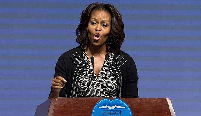 In this March 25, 2014, photo, U.S. first lady Michelle Obama delivers a speech at Chengdu No. 7 High School in Chengdu in the southwestern province of Sichuan, China. 