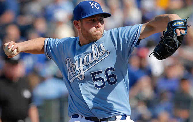 Kansas City Royals relief pitcher Greg Holland delivers to a Minnesota Twins batter during the ninth inning of a baseball game at Kauffman Stadium in Kansas City, Mo., Saturday, April 19, 2014. Holland registered his sixth save of the season as the Royals defeated the Twins 5-4. 