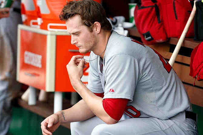 St. Louis Cardinals starting pitcher Shelby Miller sits in the dugout during the fourth inning of a baseball game against the Washington Nationals at Nationals Park Sunday, April 20, 2014, in Washington. 