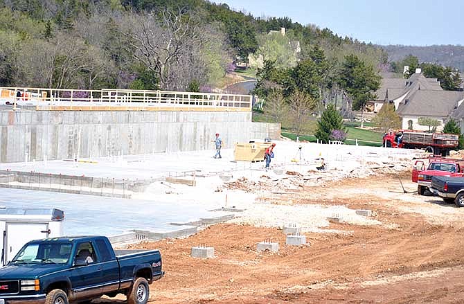 Workers continue with construction of The Lodge at Old Kinderhook's outdoor pool Thursday. The 80,000-square foot hotel, conference and entertainment complex is scheduled to open in early 2015 at the Lake of the Ozarks. 