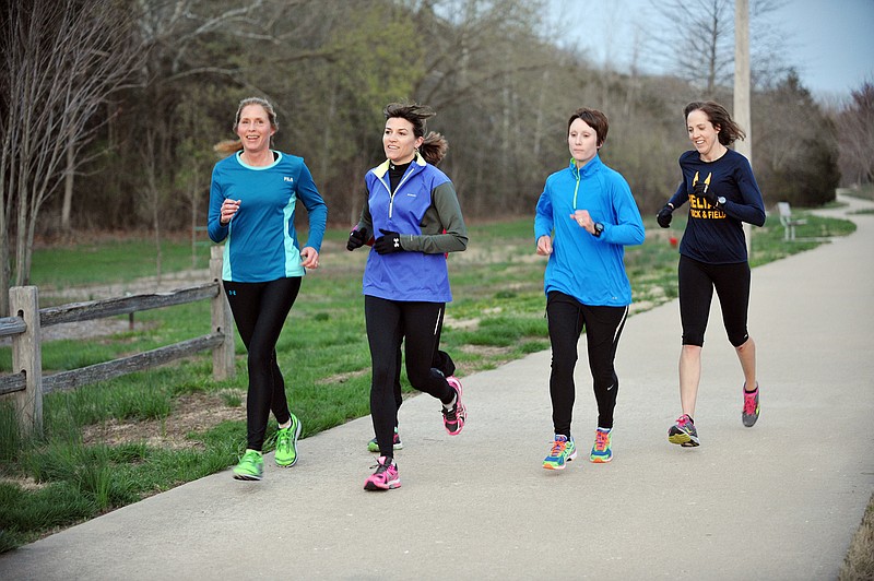 Patty Burmeister, at left, and friends get in a morning run Thursday as Burmeister prepares for the Boston Marathon. Running with her are Julie Miller, second from left, Kerri Morris and Kathy Frese, at right. 