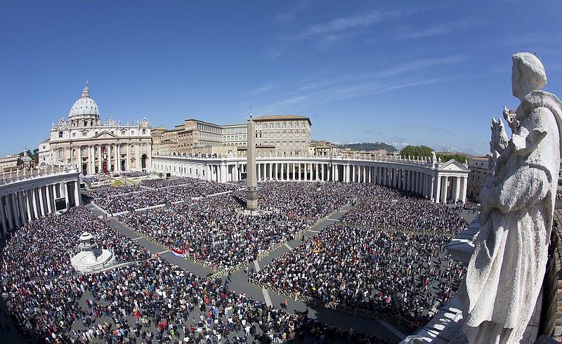 A large crowd is seen in St. Peter's Square from the Bernini colonnade during Pope Francis' Easter Mass, at the Vatican.
