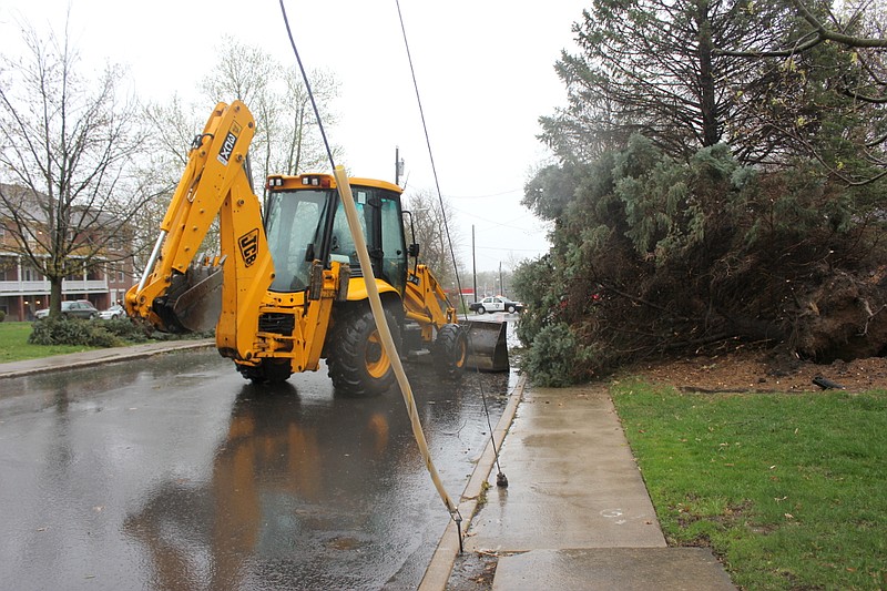Wind tore a large spruce tree out of the ground at 10th Street and West Avenue in Fulton, blocking 10th and causing Fulton fire and police officials to divert traffic while crews removed the debris.