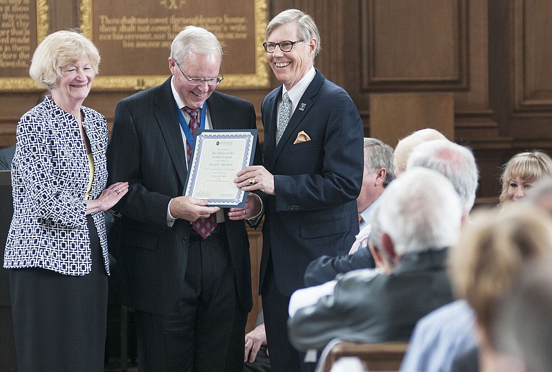 Westminster College President Barney Forsythe (right) hands David Marshall, Westminster Class of 1964, a certificate of The Order of the Golden Legion - a honor given to graduates of 50 years or more - during the Alumni Awards Convocation on Saturday.